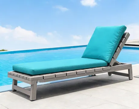 Polywood lounge chair beside a pool